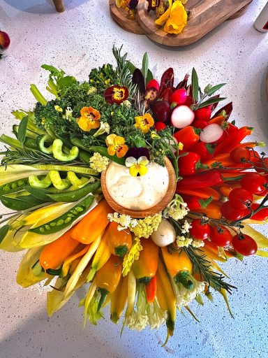 Vibrant platter of fresh seasonal vegetables with dip