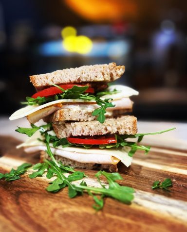 Assorted artisan sandwiches with fresh fillings on crusty bread